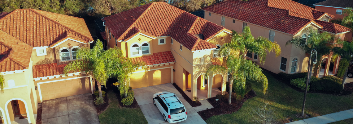 Front view villa with car on drive